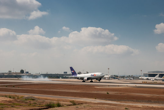 BEN-GURION AIRPORT, ISRAEL - JULY 21, 2010: The Fedex airplane landing  in Ben-Gurion Airport. Israel