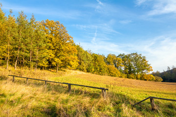 Fototapeta na wymiar Wooden corral in autumn landscape