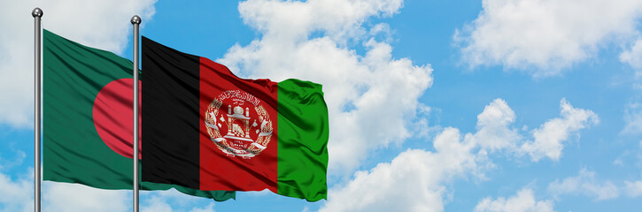Bangladesh and Afghanistan flag waving in the wind against white cloudy blue sky together. Diplomacy concept, international relations.