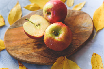 Ripe juicy apples lie among the fallen golden fossil foliage.