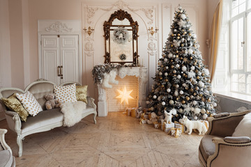  bright living room with a decorative fireplace and Christmas tree