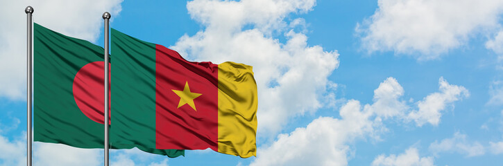 Fototapeta na wymiar Bangladesh and Cameroon flag waving in the wind against white cloudy blue sky together. Diplomacy concept, international relations.