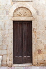 Fototapeta na wymiar old door in the wall, fortress, Montenegro