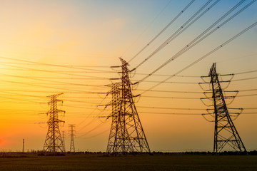 Electricity tower silhouette and sky landscape at dusk