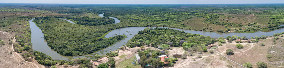 Panoramic areal view of typical Pantanal landscape, meandering tropical river through rainforest and deforested areas, Pantanal Wetlands, Mato Grosso, Brazil
