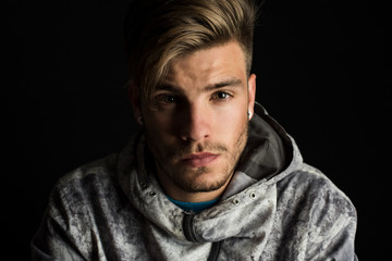 Fototapeta premium portrait of young boy, studio photo, looking at the camera with a serious attitude