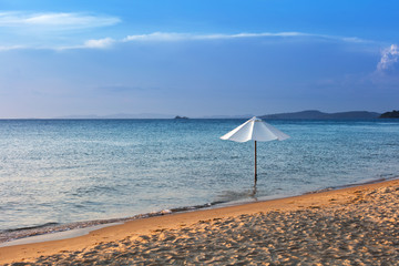 white umbrella on the beach