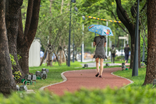 woman walking with an umbrella