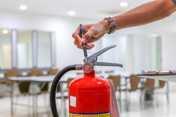 Red fire extinguishers available in fire emergencies,safety concept.