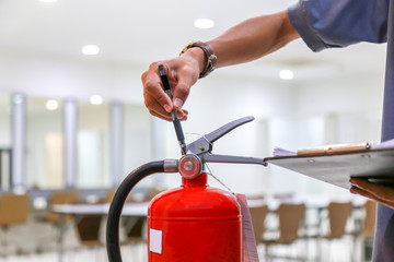 Naklejka premium Red fire extinguishers available in fire emergencies,safety concept.
