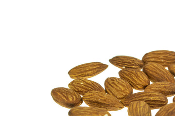 pile of almonds seeds isolated on white background.