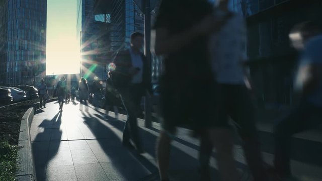 Dolly Hyperlapse Crowd Office Workers People Businessmen In Modern Metropolis Area Steel Glass Skyscrapers City Life Traffic. Moscow Russia Business District Center Capital. Bright Sun Reflection