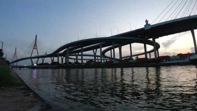Time lapse of the Bhumibol Bridge at twilight time. Bhumibol Bridge also known as the Industrial Ring Road Bridge.