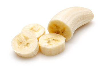Peeled ripe banana slices isolated on white background
