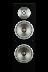 Black high gloss music speakers tower isolated on black background 