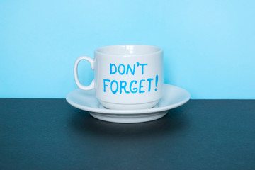 Written words Don`t Forget on the blue background.