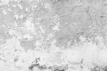 Texture of a concrete wall with cracks and scratches which can be used as a background