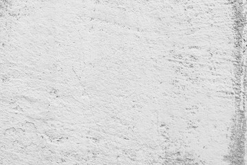 Texture of a concrete wall with cracks and scratches which can be used as a background