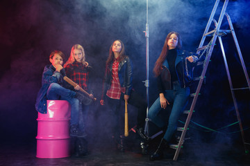 Rebel youth. Full length portrait of cocky children in stylish jeans and leather clothes. Concept...