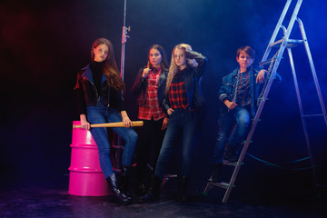 Rebel youth. Full length portrait of cocky children in stylish jeans and leather clothes. Concept...