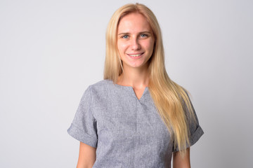 Face of happy young beautiful blonde woman smiling