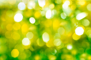 Obraz premium Yellow and green bokeh festive background