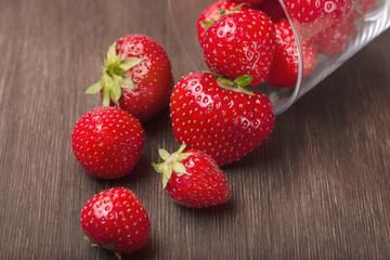 Ripe strawberries on a wooden background