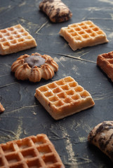 flat lay image of the wafer on the dark table, pattern cookies,