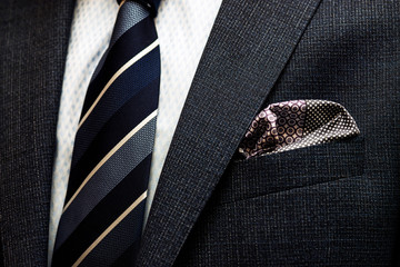 Fototapeta Business suit details, tie, jacket and handkerchief obraz