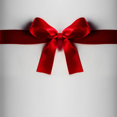 Red gift bow on white