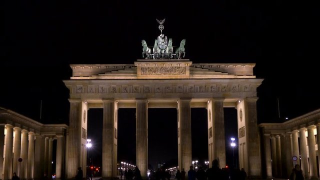 4K Tilt up video clip of people at night by The Brandenburg Gate, Pariser Platz, Berlin, Germany