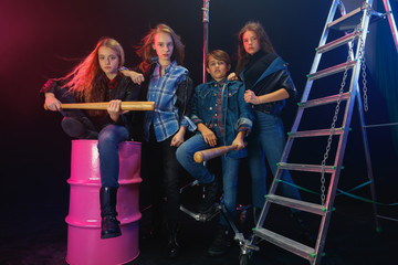 Rebel youth. Full length portrait of cocky children in stylish jeans and leather clothes. Concept...