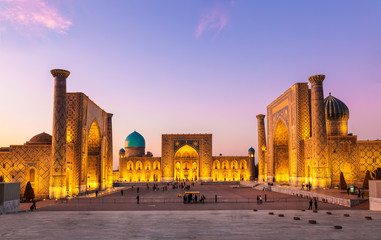 View of Registan square in Samarkand - the main square with Ulugbek madrasah, Sherdor madrasah and Tillya-Kari madrasah at sunset. Uzbekistan