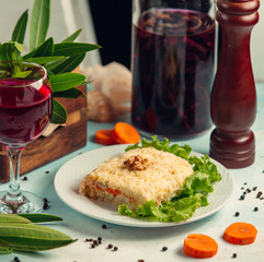 mimoza salad in the plate is served with red wine