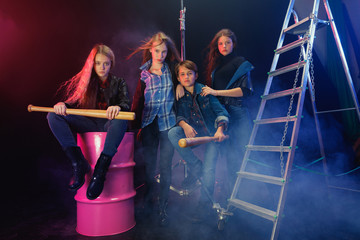 Rebel youth. Full length portrait of cocky children in stylish jeans and leather clothes. Concept...