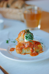 Delicious cabbage rolls on white plate in restaurant.