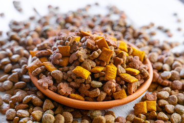 Clay bowl with a dry pet food