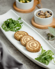decorated three pates with greens in the plate
