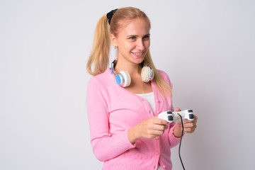 Portrait of young blonde nerd woman playing games