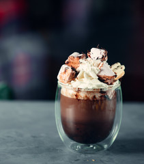glass of ice cream decorated with chocolate