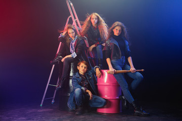 Rebel youth. Full length portrait of cocky children in stylish jeans and leather clothes. Concept...