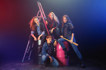 Rebel youth. Full length portrait of cocky children in stylish jeans and leather clothes. Concept...