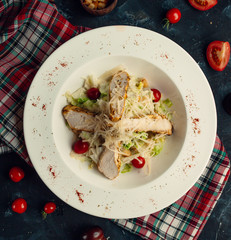 top view of chicken salad is mixed with fresh vegetables