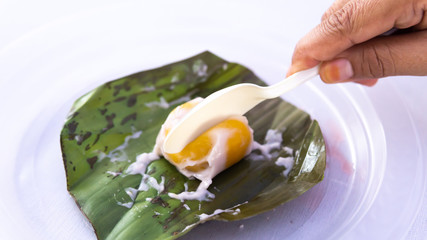 Close up of Pumpkin Koci or Kuih Koci Labu, the Malay glutinous rice flour made of pumpkin.