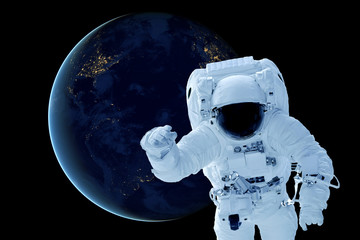 Fototapeta na wymiar Astronaut above the planet Earth. Elements of this image were furnished by NASA.