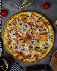top view of mushroom pizza served with tomato