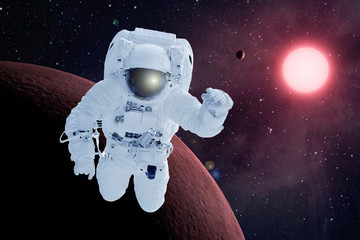 Fototapeta na wymiar Astronaut in orbit of the red planet. Elements of this image were furnished by NASA.