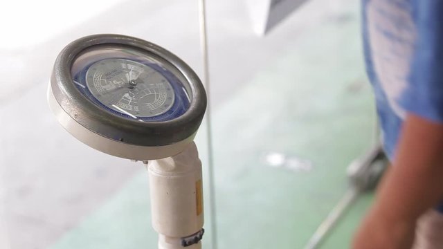 Chonburi, Thailand-September 20, 2019: The doctor checking sick person with Weighing apparatus or weight meter.