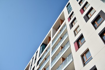 Modern apartment buildings on a sunny day with a blue sky. Facade of a modern apartment building