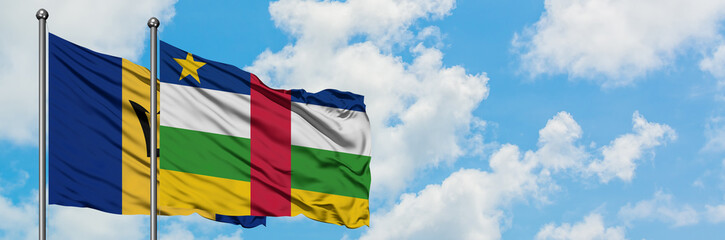 Barbados and Central African Republic flag waving in the wind against white cloudy blue sky together. Diplomacy concept, international relations.